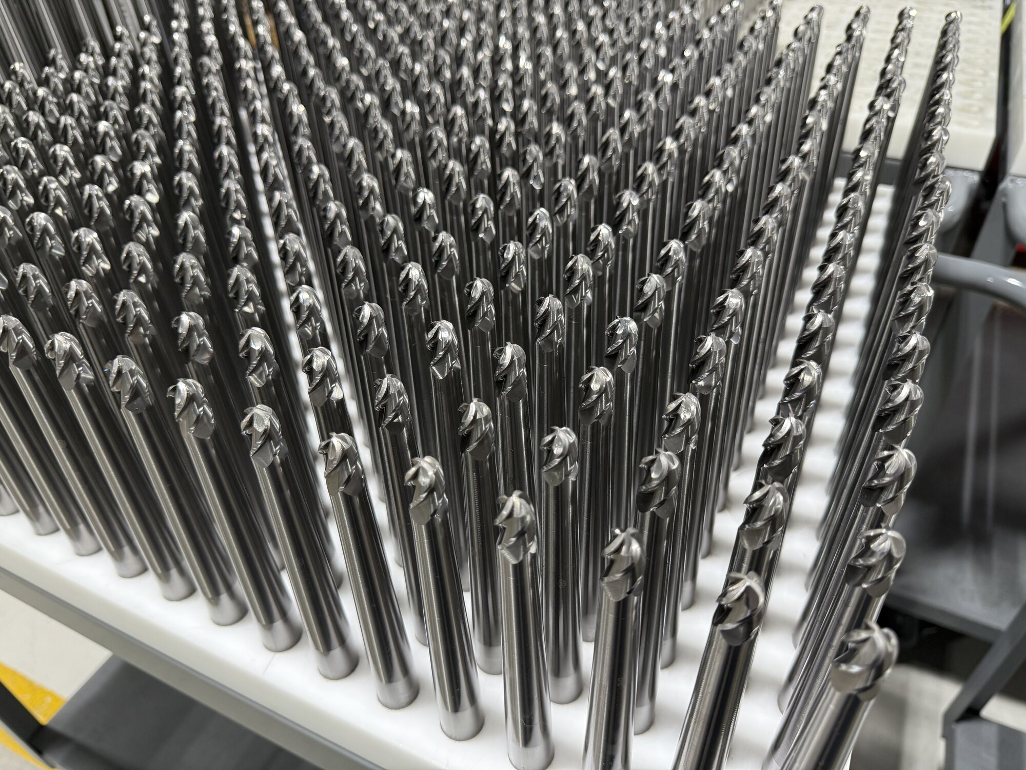Rows of solid carbide end mills manufactured by Ostrem Tool